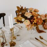 banquet table decorated with candles and flowers